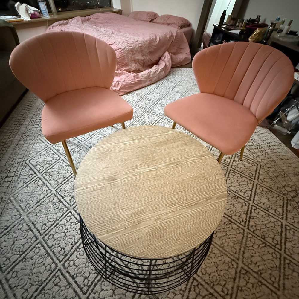 Elegant Pink Accent Chairs with Round Wooden Table